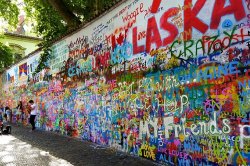 Musicans infront of John Lennon Wall